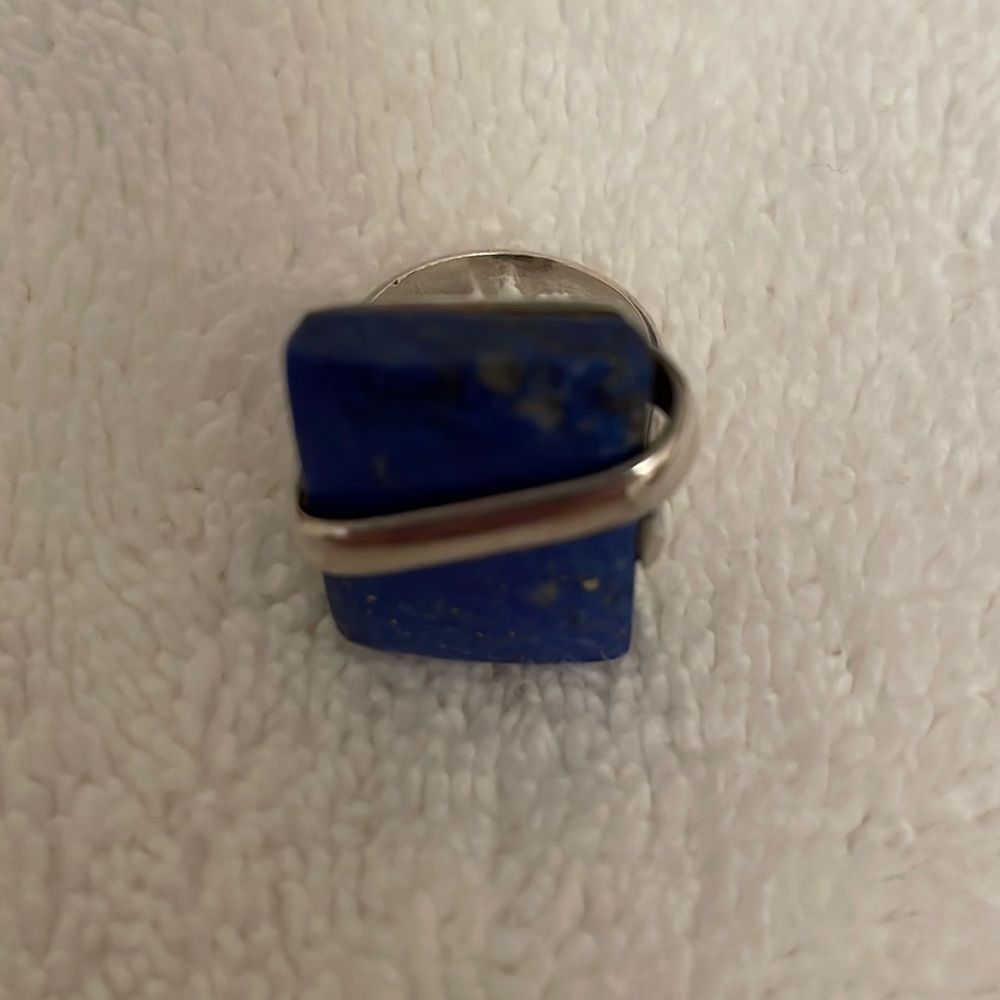 Ring with gorgeous blue stone. The stone is approx. 1/2 inch x 3/4 inch.in size.